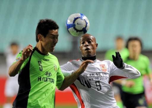 Johnny Woodly durante su paso por el fútbol de China.|AFP